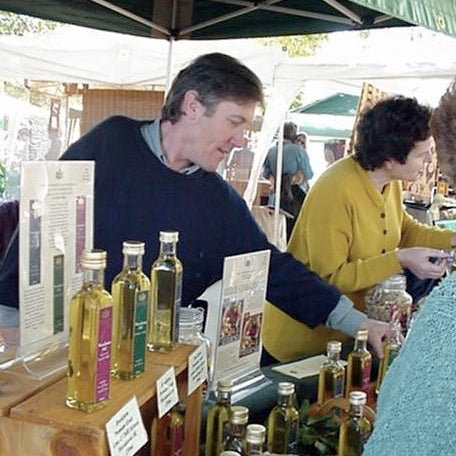 Martin Brook selling Brookfarm Macadamia Oil at Bangalow Markets in 2000