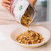 Pouring Toasted Muesli with Cranberry from pack